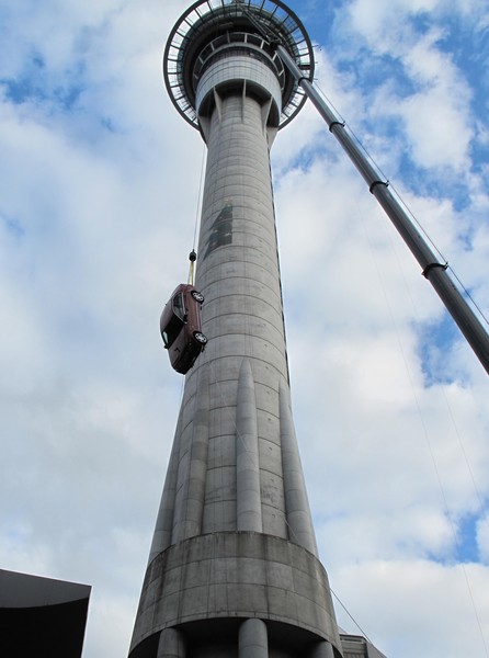Car and cradle are craned up to be fixed on the side of the Sky Tower.